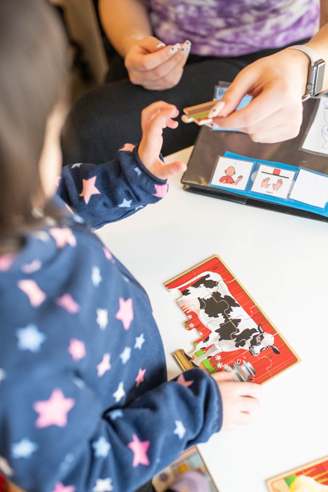 up early intervention clinic about child working on puzzle